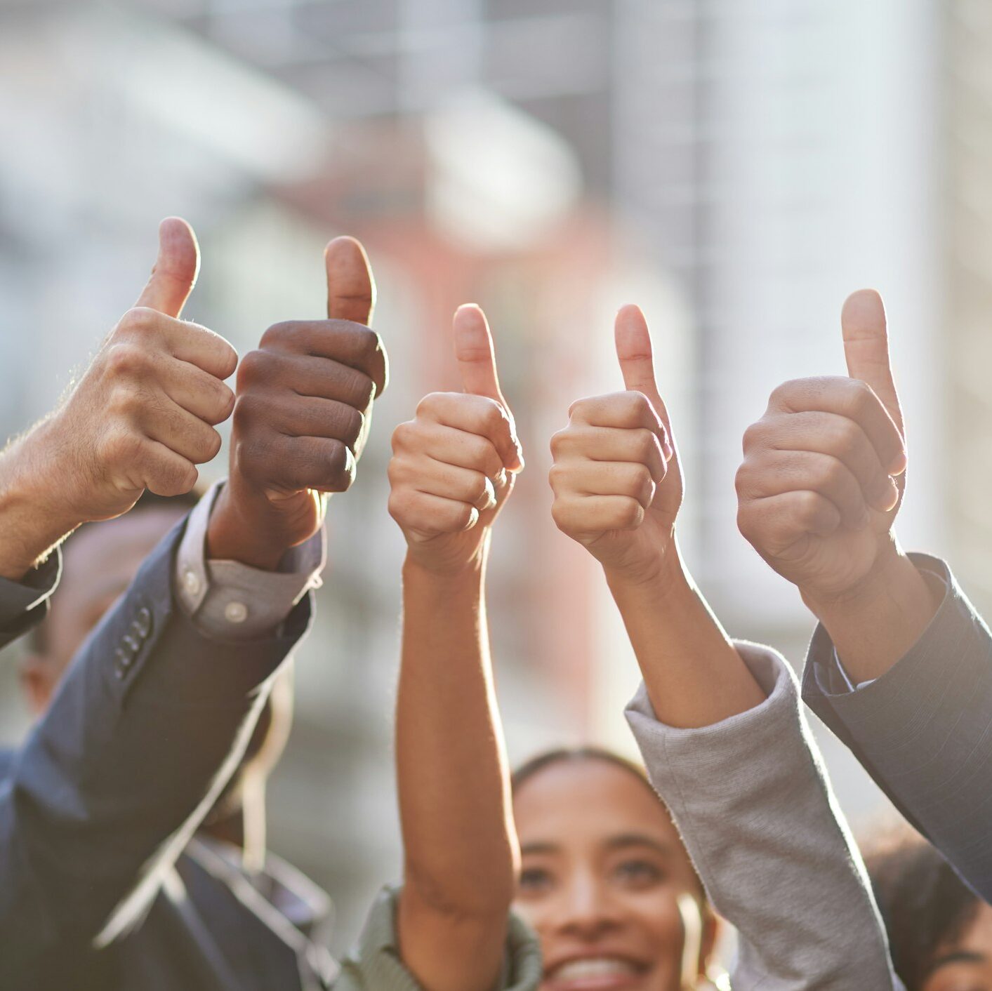 Our optimism is unbeatable. Shot of a group of businesspeople giving the thumbs up.